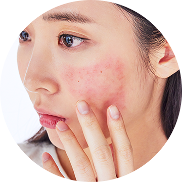 a woman applying sunblock